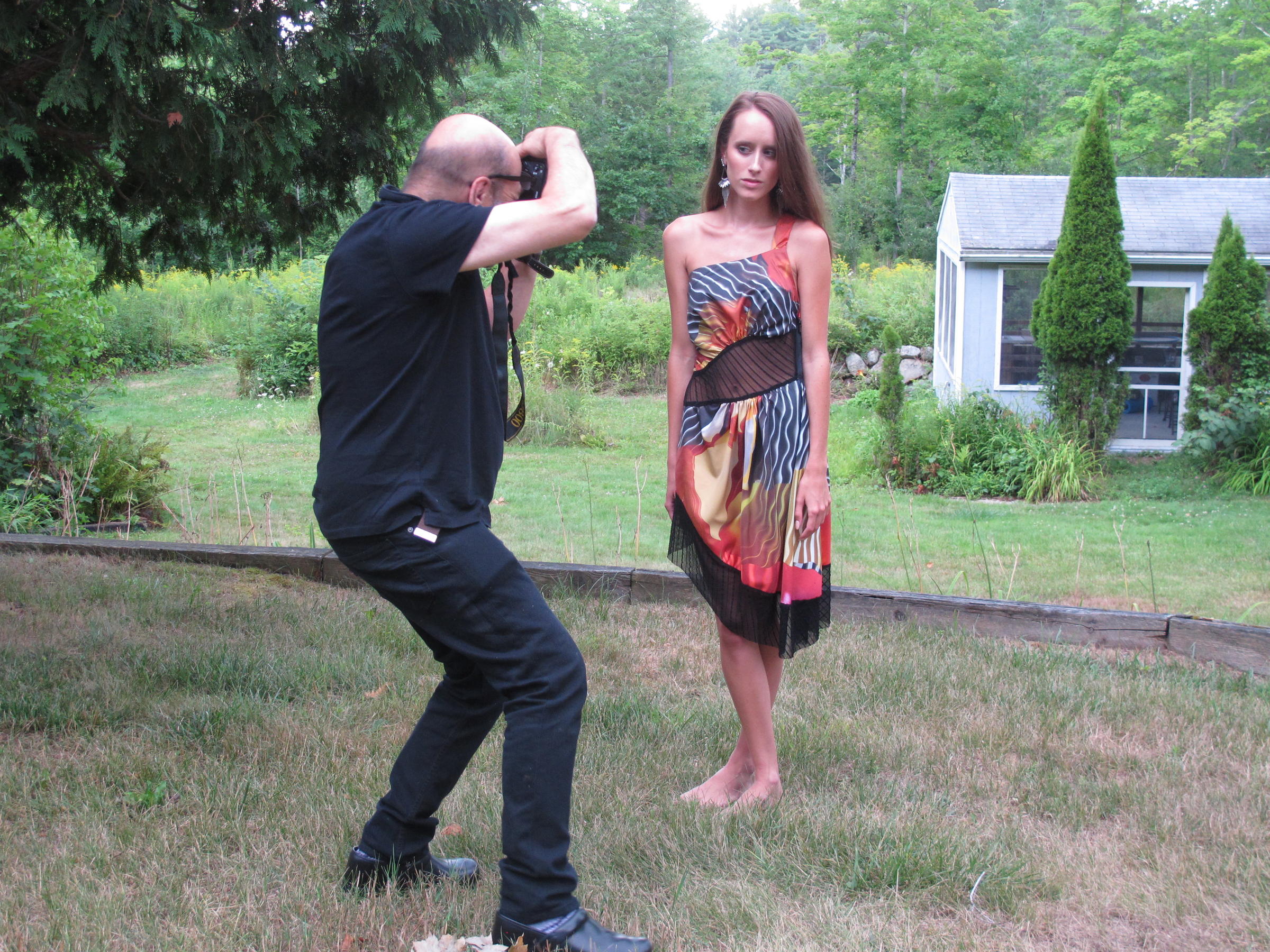 Fabric designer Harry Umen, photographs Hailey Boczar modelling a dress. EMILY CORWIN / NHPR