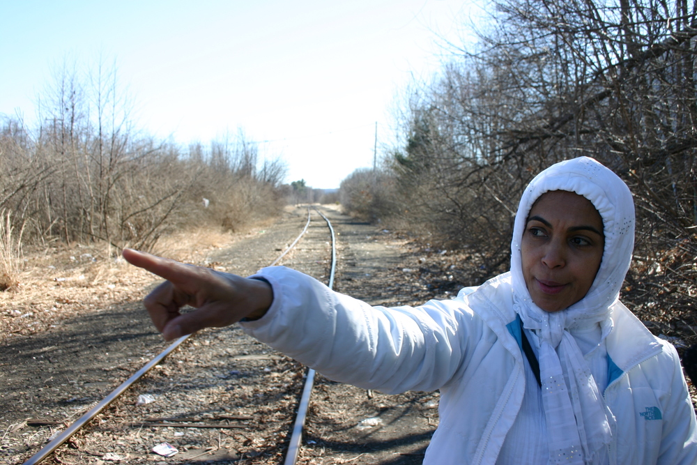 Liza Urena points to one of the places her friend Gene Parker slept. She brought him meals and gave him rides almost every day, and helped him find safe spots to sleep.