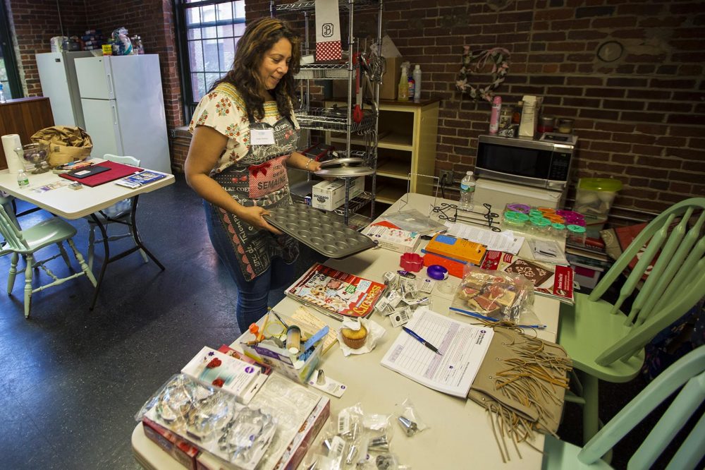 Angie Jimenez is a graduate of Entrepreneurship for All, a business accelerator program in Lawrence. She's starting a cooking school in a renovated mill building in the city. (Credit: Jesse Costa/WBUR)