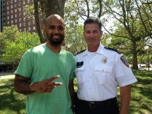 Jose Jose Rodriguez (L) stands with Providence Police Officer Dean Isabella. (Credit: John Bender: RIPR)