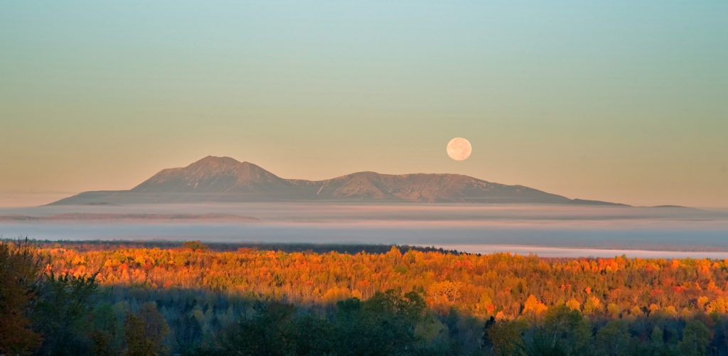 The moon rises over Mt. Katahdin. (Bill Duffy)