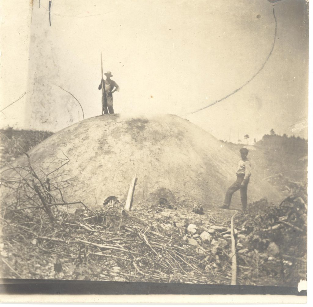 Colliers would build a ladder on one side of the mound to access upper portions. When jumping the pit, some colliers would hold their shovels parallel to the ground. That way, in case they fell into the hole -- the pole would, hopefully, catch. Collection of Cornwall Historical Society 