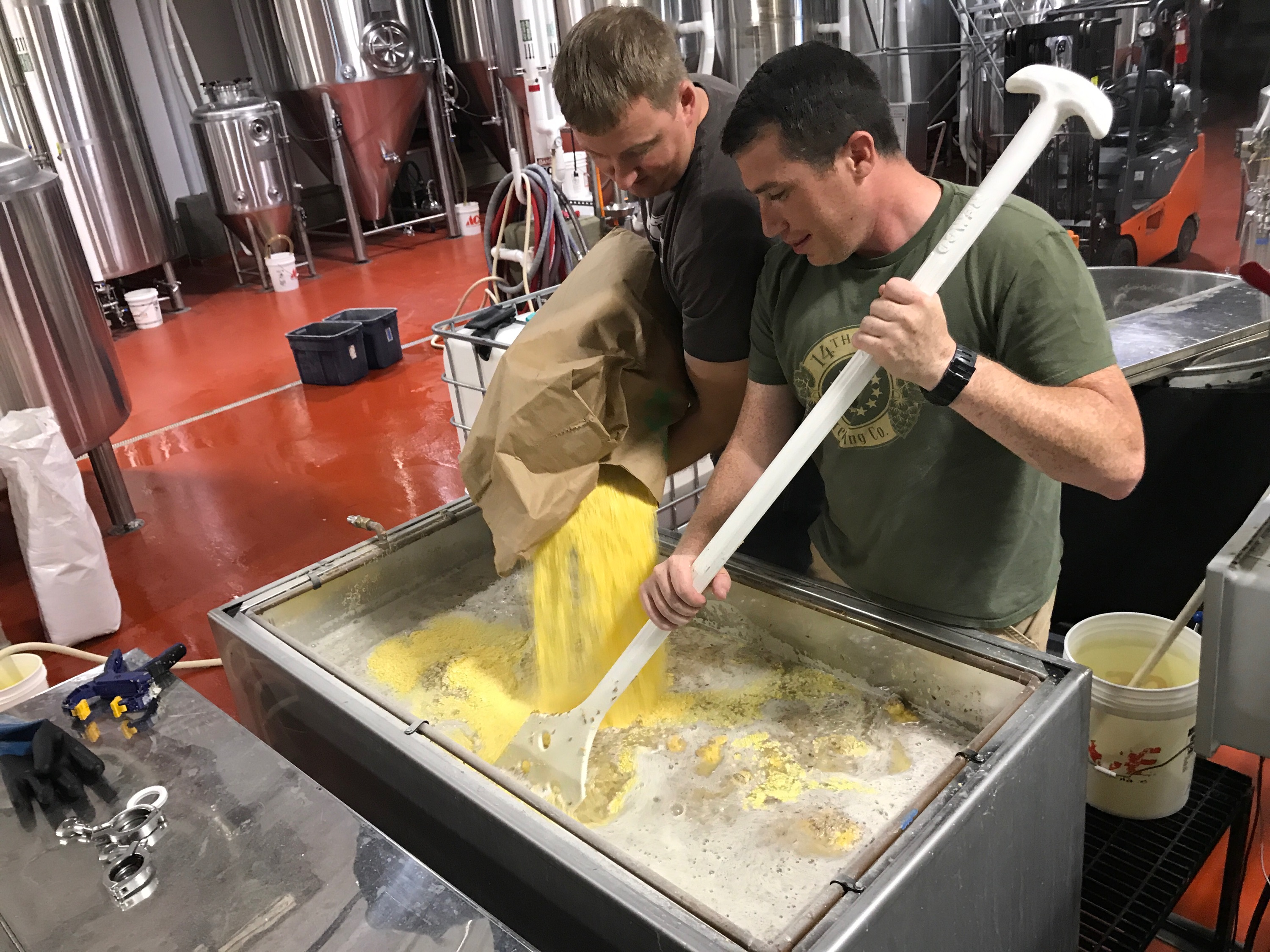 Zac Fike (L) and Matt Kehaya (R) work on a batch of beer at 14th Star Brewing Company. 14th Star donates proceeds from every batch to local nonprofits. Courtesy of Danger Close Craft Distilling