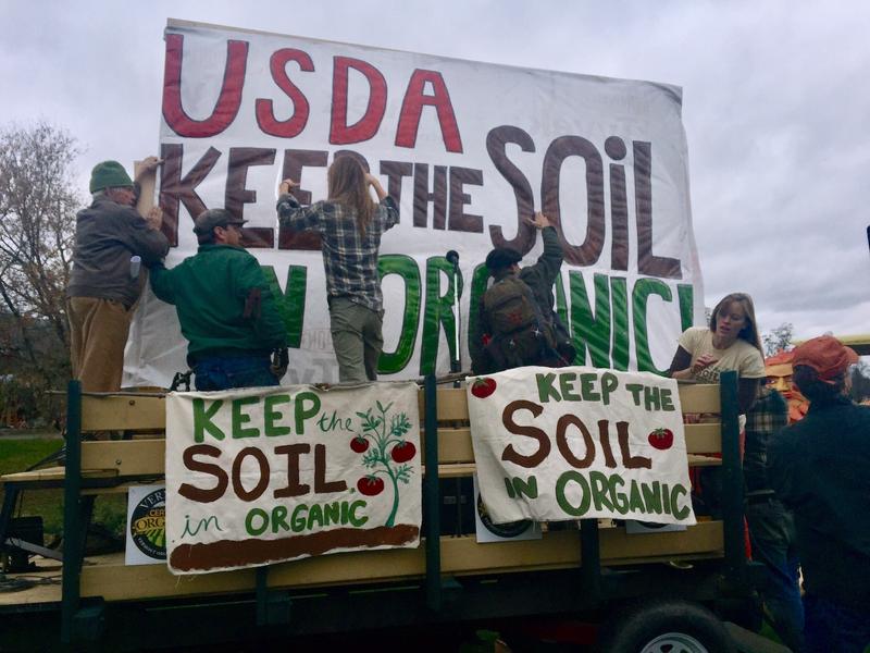 A rally in Thetford back in 2016 criticized the USDA's move to allow vegetables raised hydroponically to be labeled as "organic." Now a movement has formed to strengthen the organic label. Photo by Rebecca Sananes for VPR