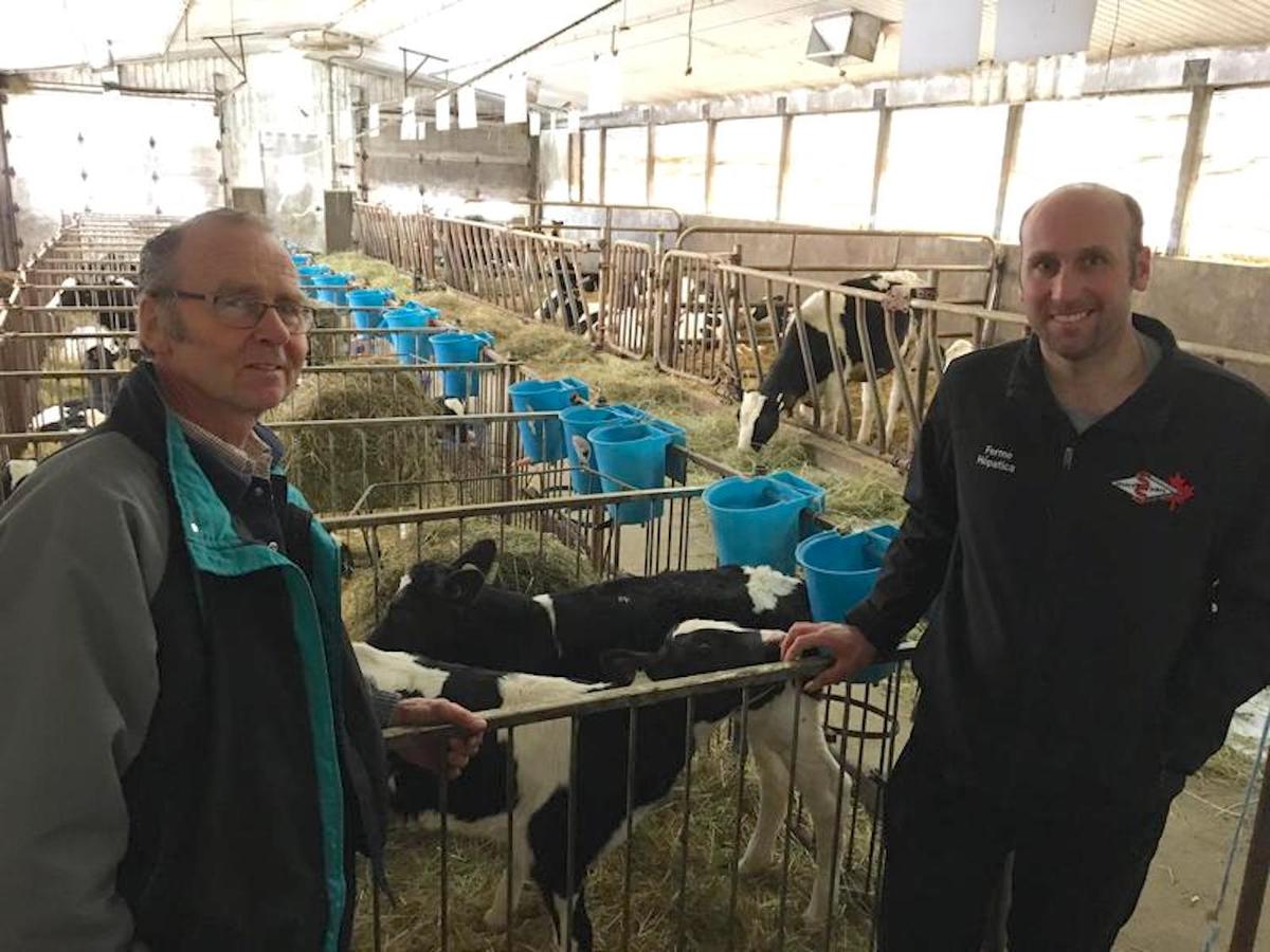 Hans Kaiser and his son Terry operate a dairy farm in St. Armand, Quebec. They say the supply management system in Canada has let them earn a good living. Photo by John Dillon for VPR