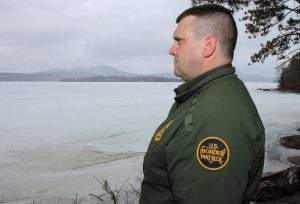 U.S. Border Patrol agent Richard Ross near the international border along Lake Memphremagog. Photo by Lorne Matalon for VPR