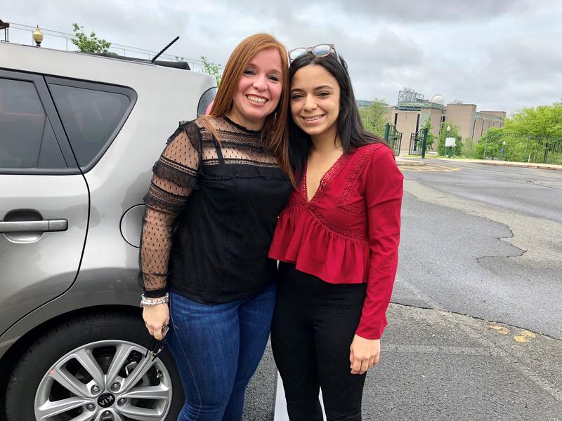 Palmira Arroyo, left, flew in from Puerto Rico for her daughter Karina Lasalle Arroyo's graduation from Central Connecticut State University. Lasalle, right, packed her mom's rental car with luggage from her stay at CCSU after Hurricane Maria. Photo by Vanessa de la Torre for Connecticut Public Radio