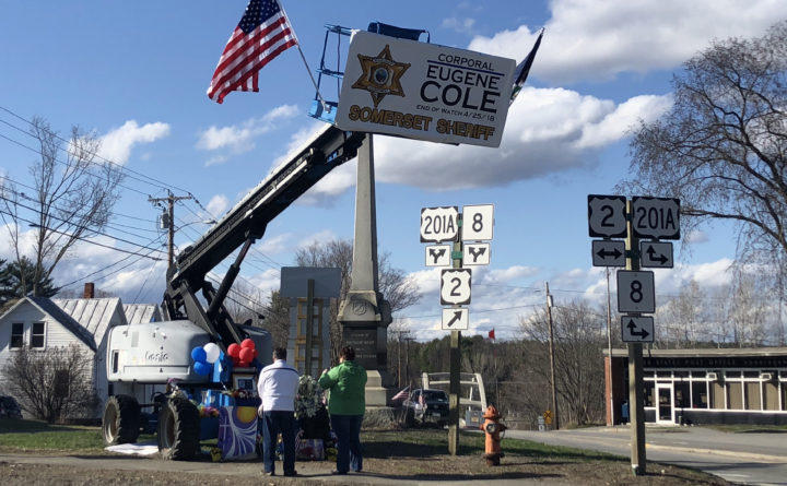 Mourners gather at a makeshift memorial for Cpl. Eugene Cole on Saturday, April 28, 2018. Photo by Callie Ferguson for the Bangor Daily News