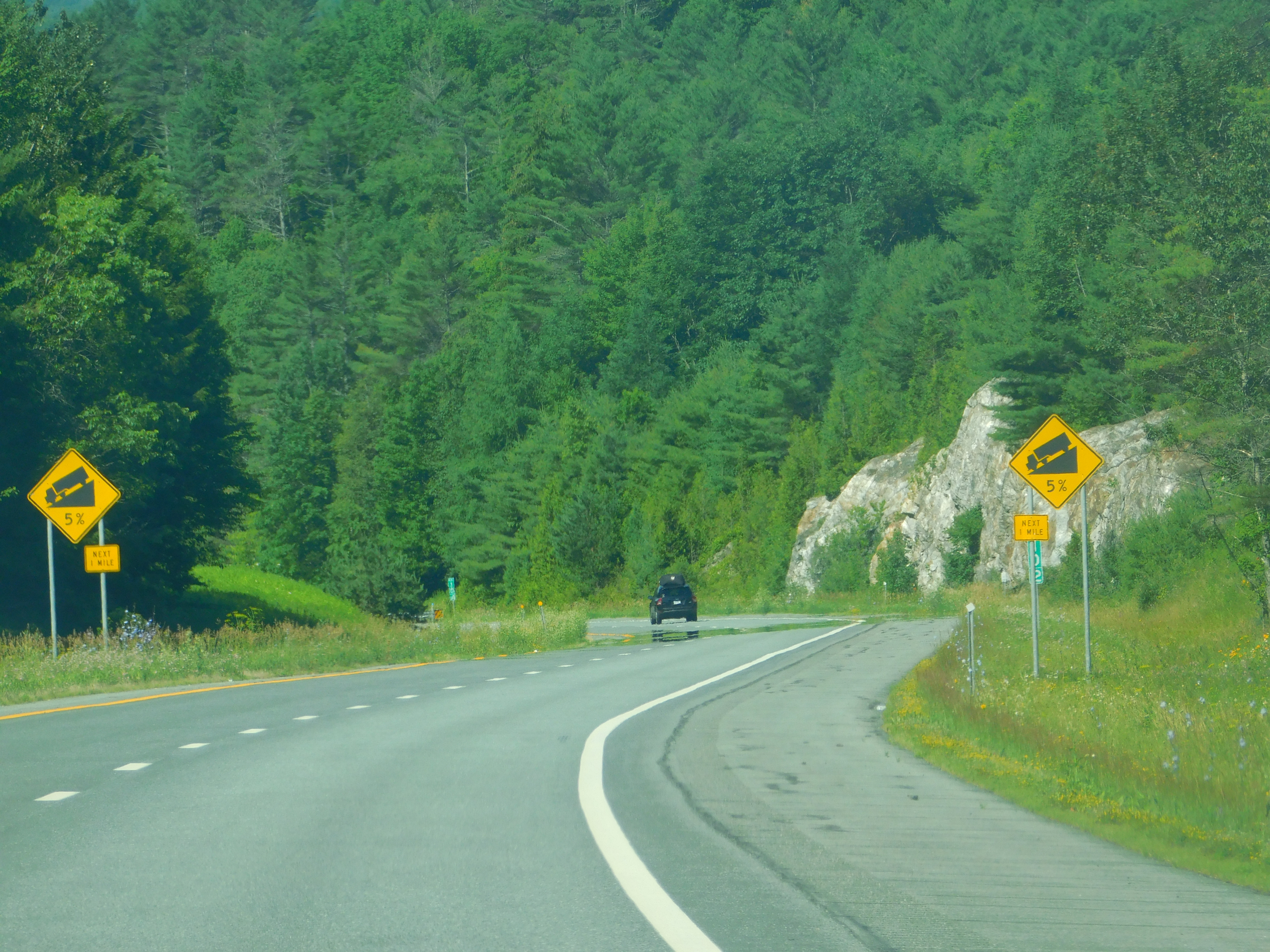 A photo of a car travelling around Interstate 93 in Vermont. Photo by Adam Moss, FLICKR