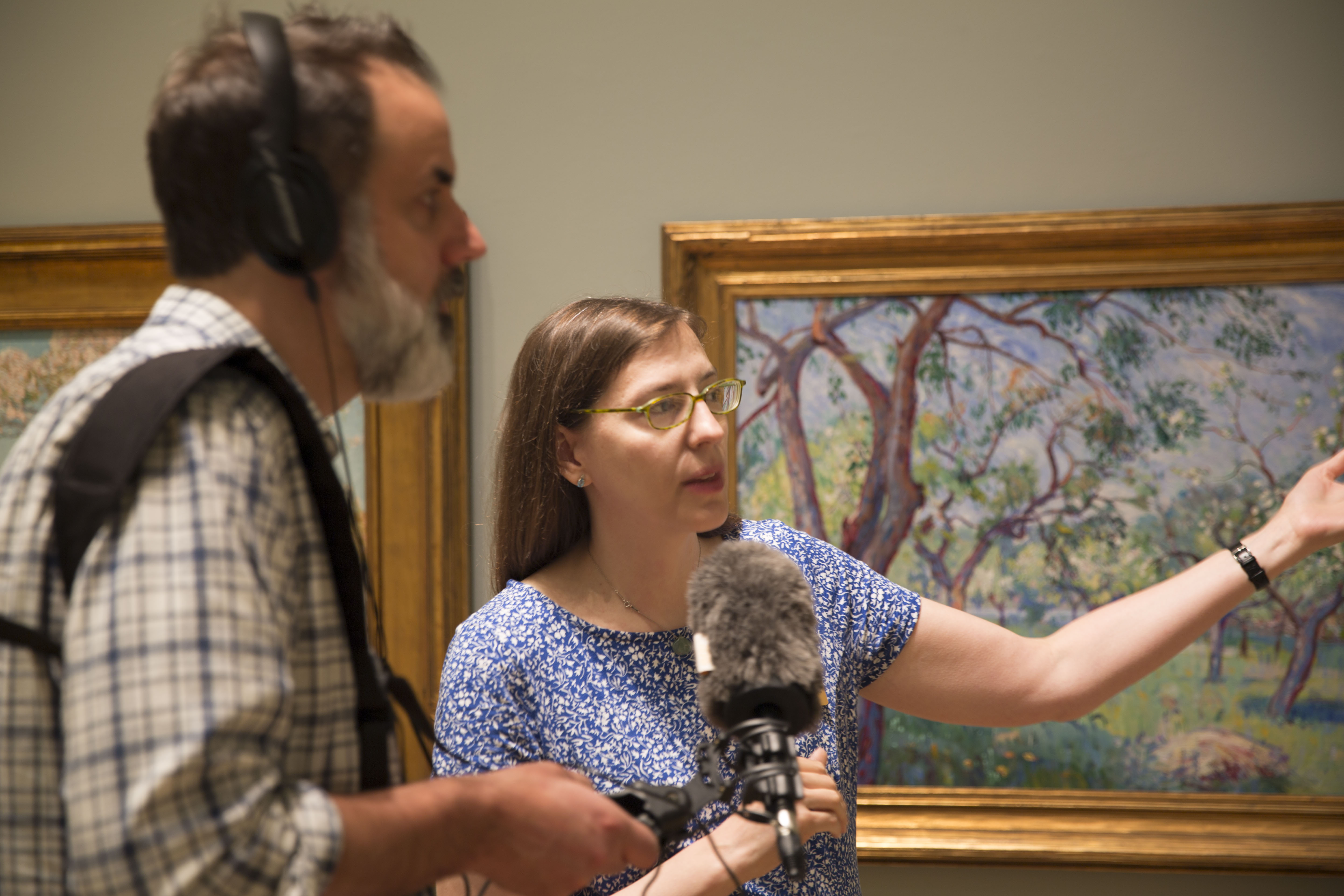 Curator Amy Kurtz-Lansing shows John Dankosky the "Art and the New England Farm" Exhibit at the Florence Griswold Museum. Photo by Carlos Mejia for Connecticut Public Radio