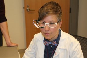 Nurse Rachel Walker, demonstrating one of her inventions. Photo by Heather Duggan from UMass