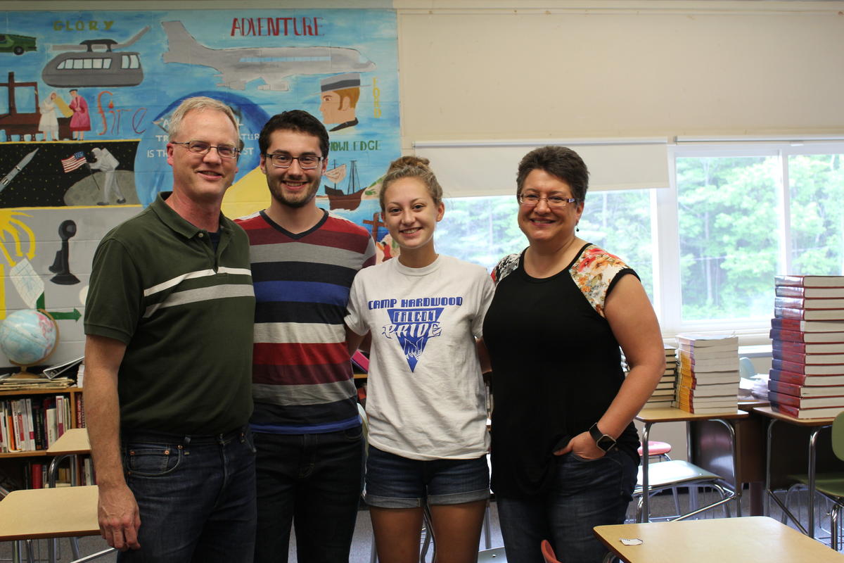 Teachers Chris and Deborah Carver pose with their two children, Brooke and Garrett, inside of a classroom at Mountain Valley High School in Rumford, Maine. Photo by Robbie Feinberg for Maine Public