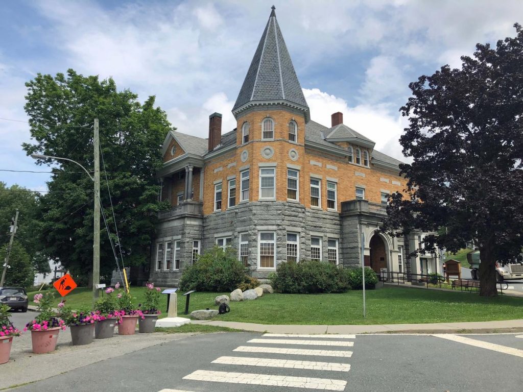 Flower pots and landscaping stones mark the international border between Stanstead, Quebec, and Derby Line, Vt. Inside the Haskell Free Library and Opera House, the border is marked by a line on the floor. Photo by Amy Kolb Noyes for VPR