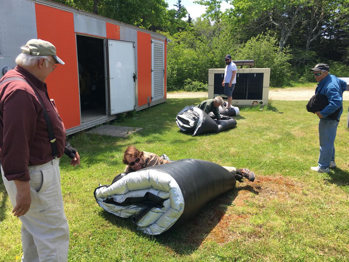 Storing tarps that protect the island's diesel generator. Photo by Fred Bever for Maine Public