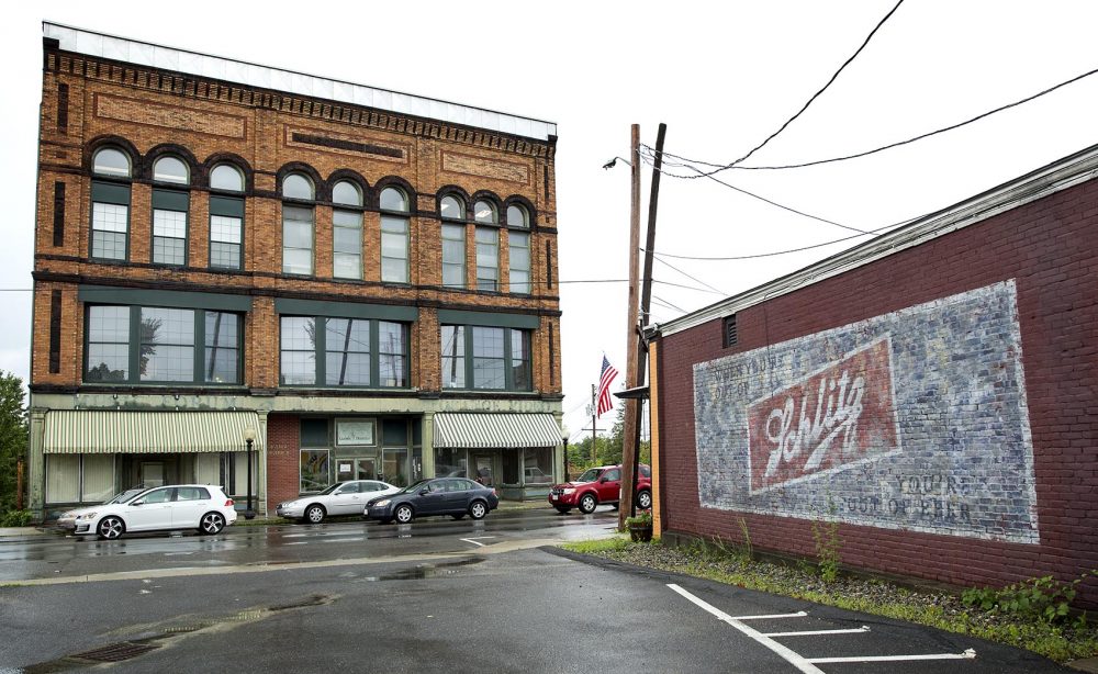 The vintage-looking Schlitz beer mural crew painted for "Castle Rock" still adorns a wall in Orange. Photo by Robin Lubbock for WBUR