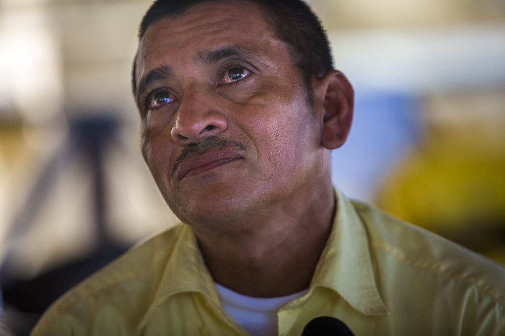 Jose Hector Galvez eyes fill with tears as he talks about his 16-year-old daughter still being detained in the U.S. after they were caught crossing the border earlier this summer. Photo by Jesse Costa for WBUR