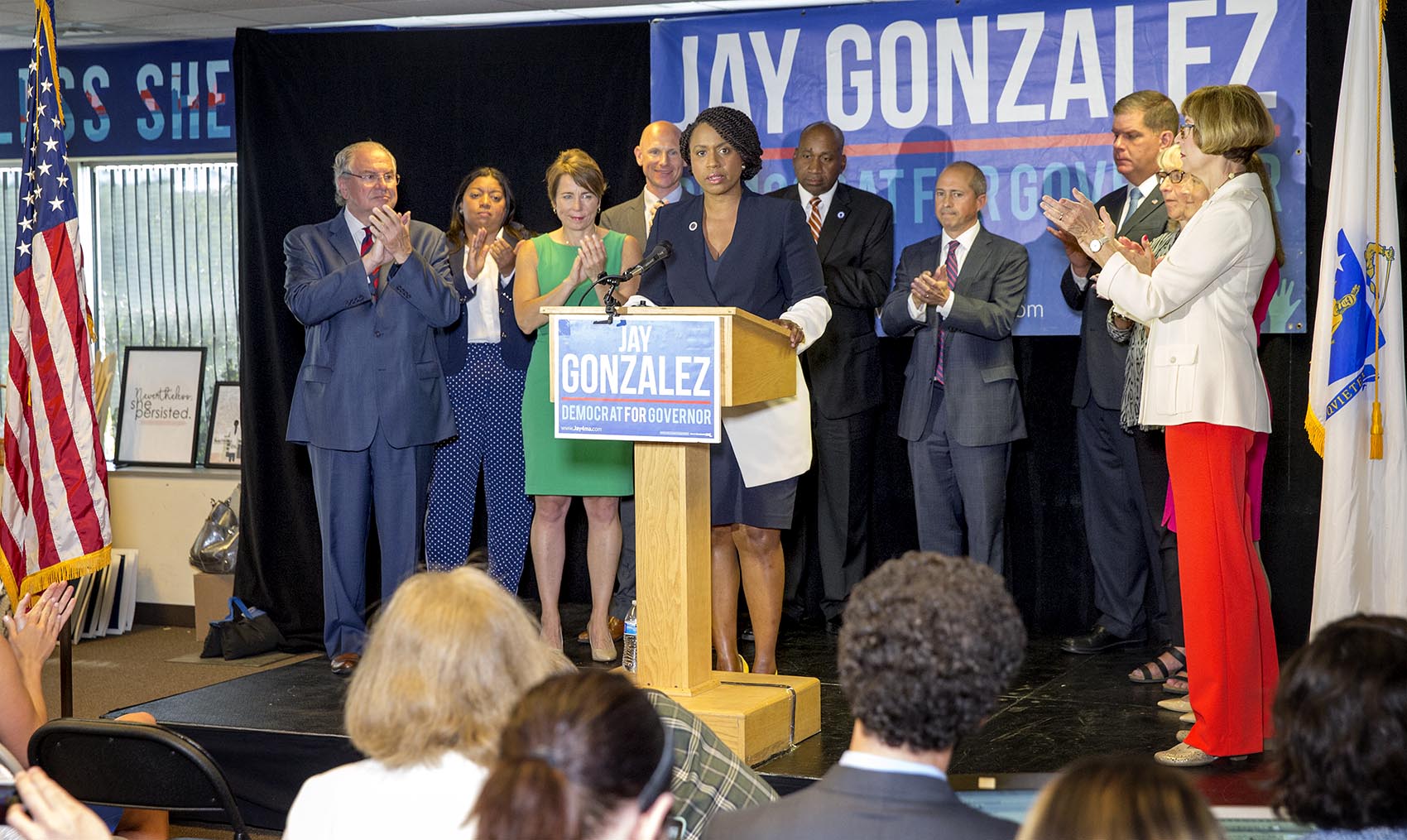 Democrats applaud Ayanna Pressley at a Massachusetts Democratic Party Unity event in Dorchester. Photo by Robin Lubbock for WBUR