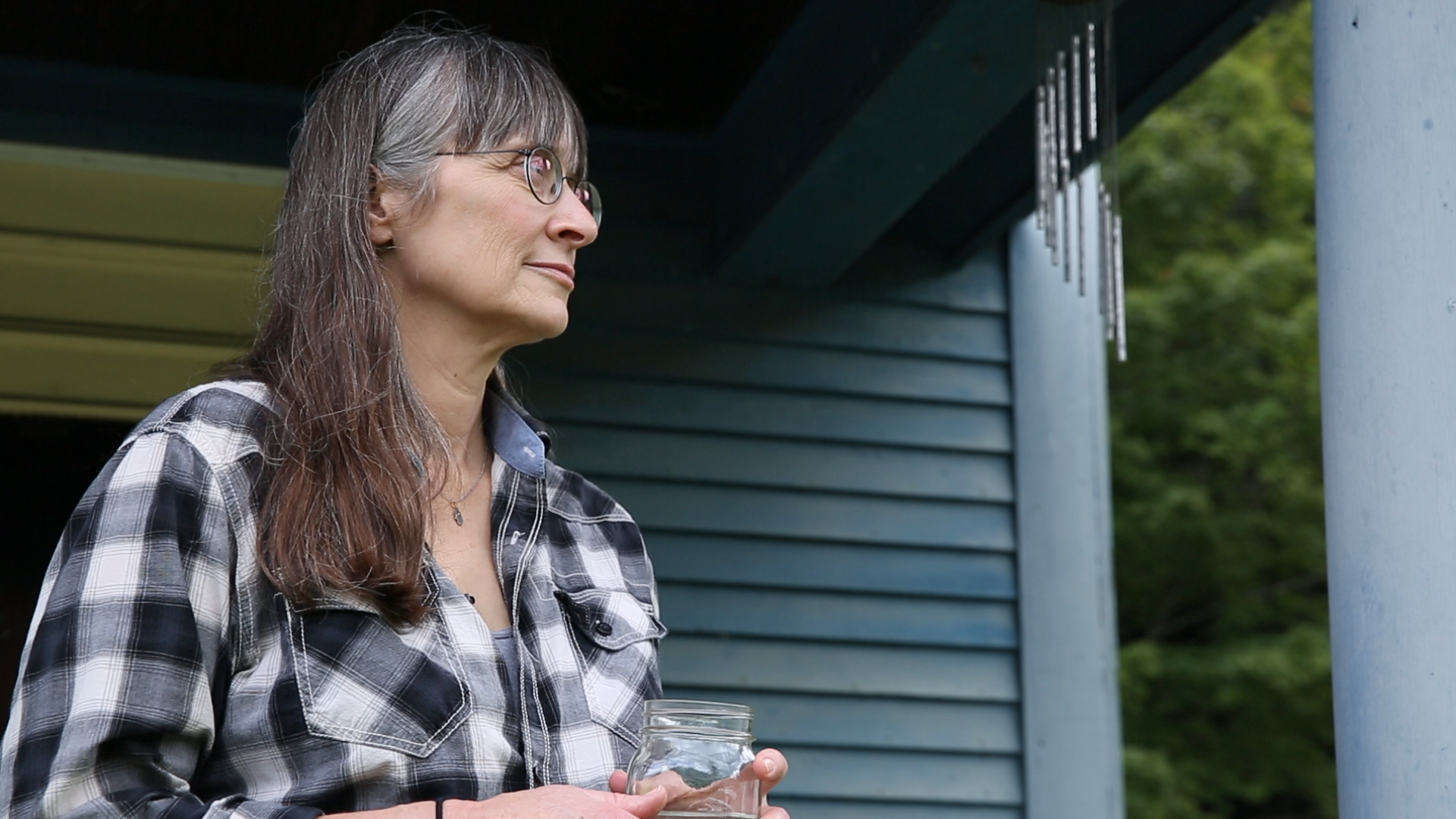 Hilary Mullins stands outside her Vermont home after she detailed the abuse she suffered as a teenager by two teachers from the Connecticut boarding school. Photo by Frankie Graziano for Connecticut Public Radio