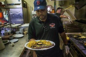 Churrasco con arroz mamposteao from The Wings Restaurant, Red Sox manager Alex Cora's favorite dish when he comes home to Caguas. Photo by Jesse Costa for WBUR