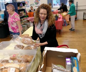 Oliva Llano visits the food pantry. Photo by Nancy Eve Cohen for NEPR