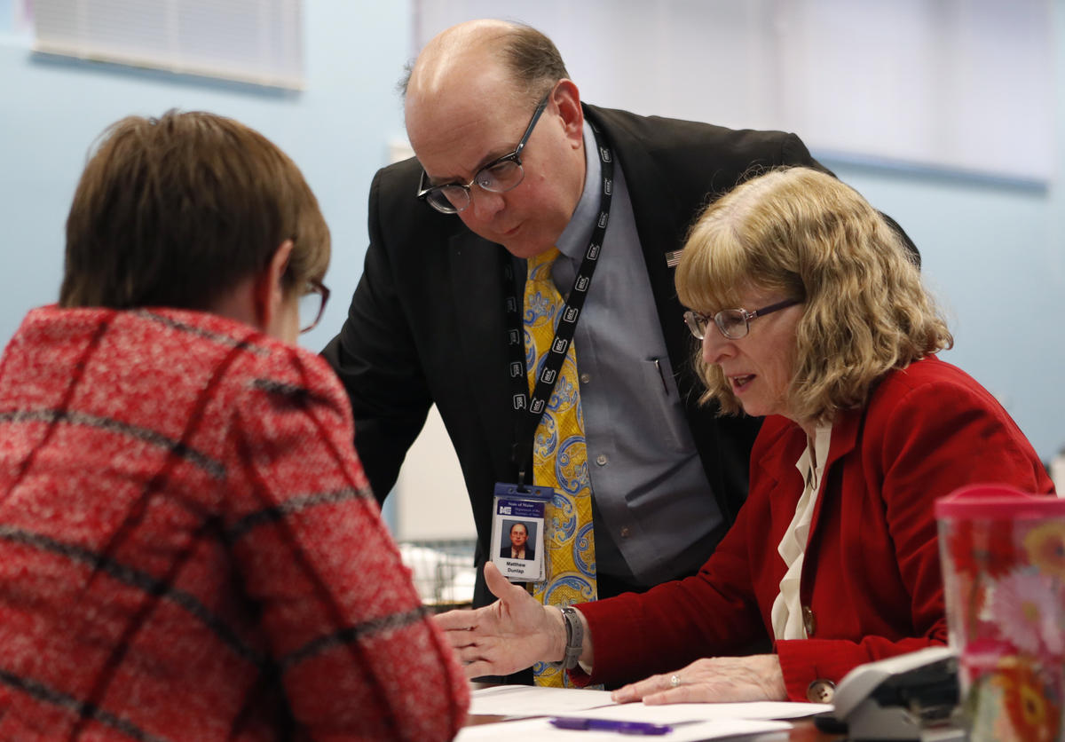 Maine Secretary of State Matthew Dunlap and Deputy Secretary of State Julie Flynn, during the ballot-tabulation process on Tuesday. In contrast to all the drama and national attention surrounding Maine's ranked-choice voting law, Secretary of State Matt Dunlap's historic runoff announcement was rather understated. Photo by Robert F. Bukaty for Maine Public