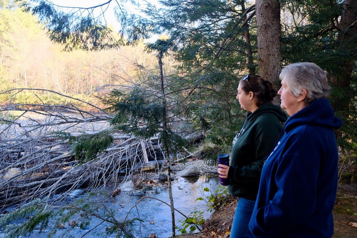 Chelsie Lent and Carole Clarke are co-owners of Scenic View Campground in Warren, NH. The Baker River, which runs along the back of their property, has flooded multiple times in recent years. Photo by Britta Greene for NHPR