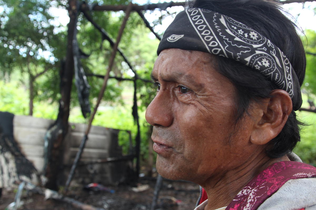 Rafael Morales stands in front of his home hours after he and neighbors allege Nicaraguan police burned it down. The motive for the attack is unclear as Morales said he is a Sandinista government supporter. Photo by Lorne Matalon for VPR