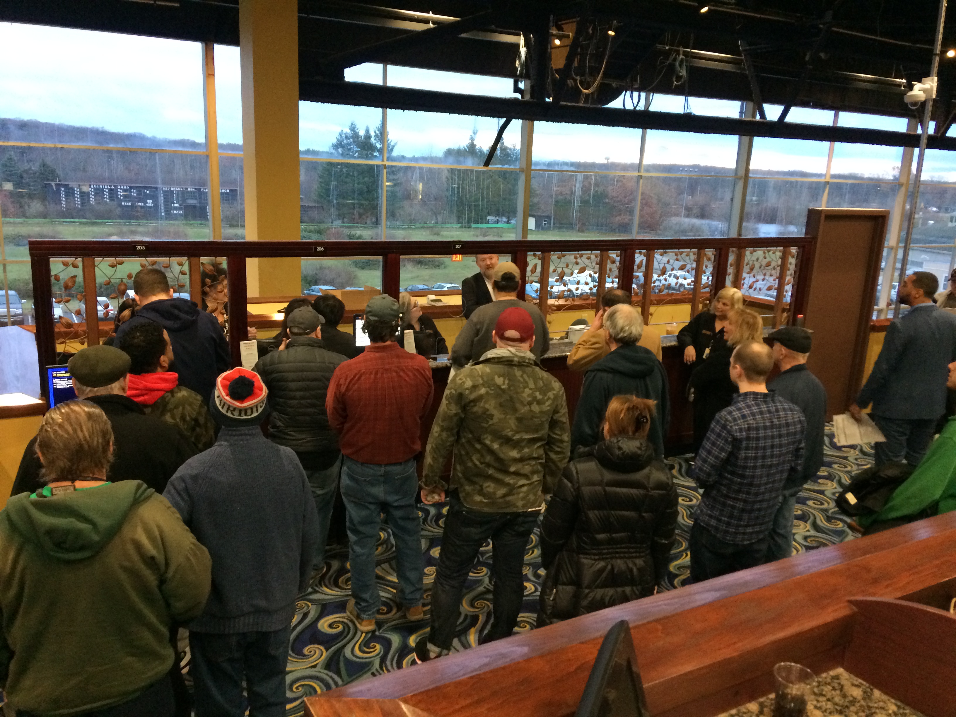 People standing in line to place their first bets. Photo by John Bender for The Public's Radio