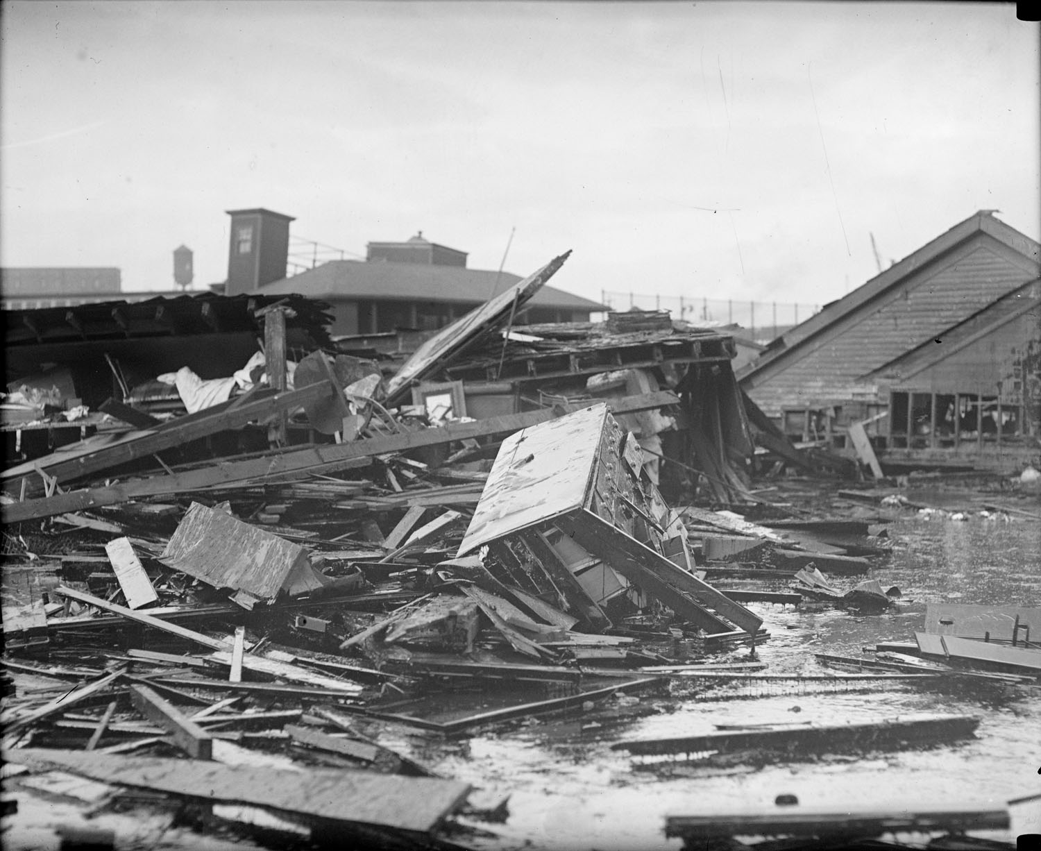 Site of Molasses Disaster showing lumberyard to left near Charleston Bridge. Photo courtesy of the Boston Public Library, Leslie Jones Collection