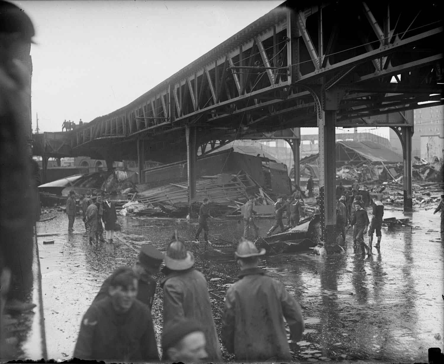 Wreckage under the elevated where many express trucks parked, Molasses Disaster. Photo courtesy of the Boston Public Library, Leslie Jones Collection