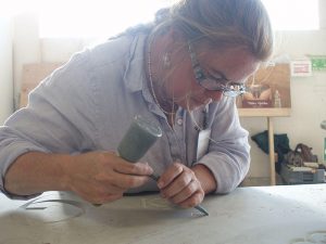 Karin Sprague is among a small group of artists who still etch stone memorials by hand. Photo courtesy of Karin Sprague