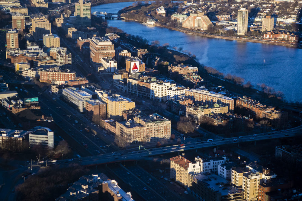 The early morning sun illuminates the Citgo Sign and the tops of other buildings around Kenmore Square. Photo by Jesse Costa for WBUR