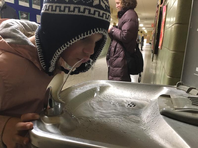 Evan Chamberlin, 9, drinks from a water fountain at Union Elementary School in Montpelier. Union Elementary was one of the few schools that voluntarily tested its water for lead following a state-sponsored pilot study. Photo by Howard Weiss-Tisman for VPR