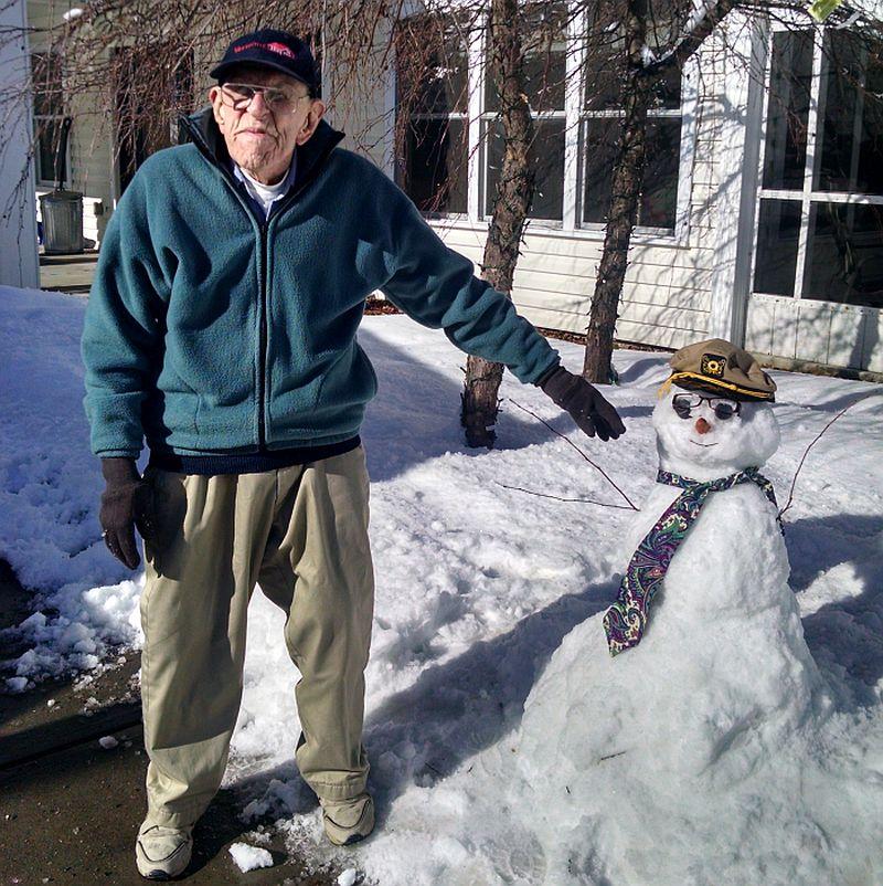 Warren Patrick of Townshend still has the energy to build a snowman in the middle of winter. Photo by Dawn Slade for Valley Cares