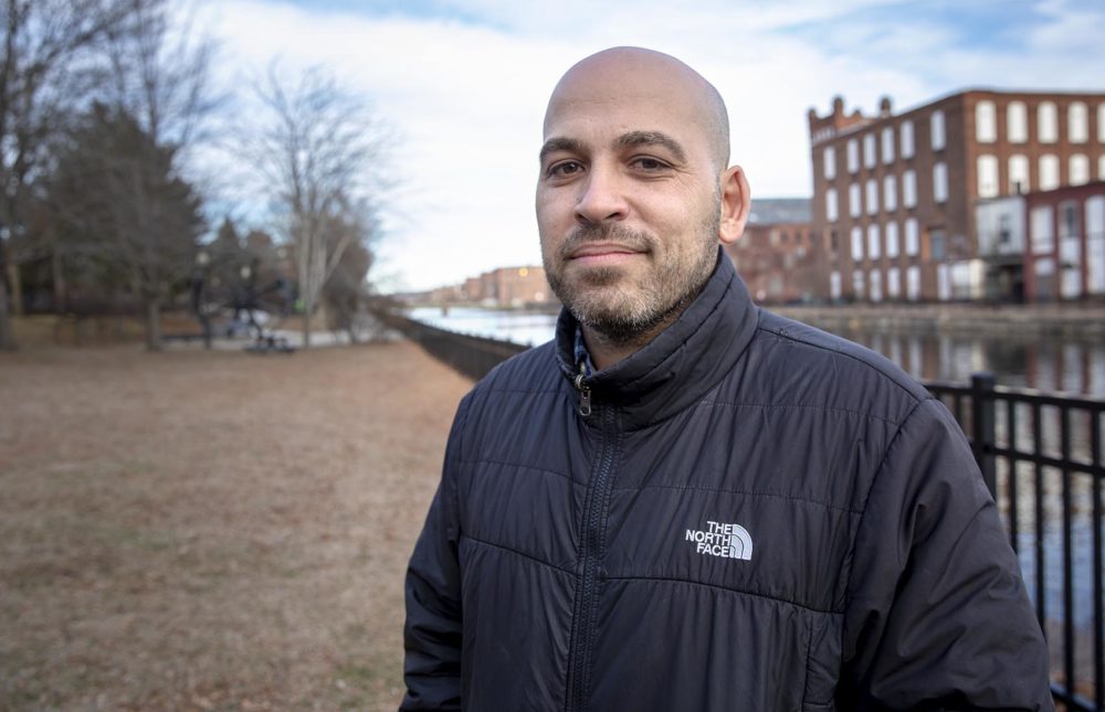 Jose Bou, Equity Family And Community Partnerships Manager with Holyoke Public Schools, by the first level canal in Holyoke. Photo by Robin Lubbock for WBUR