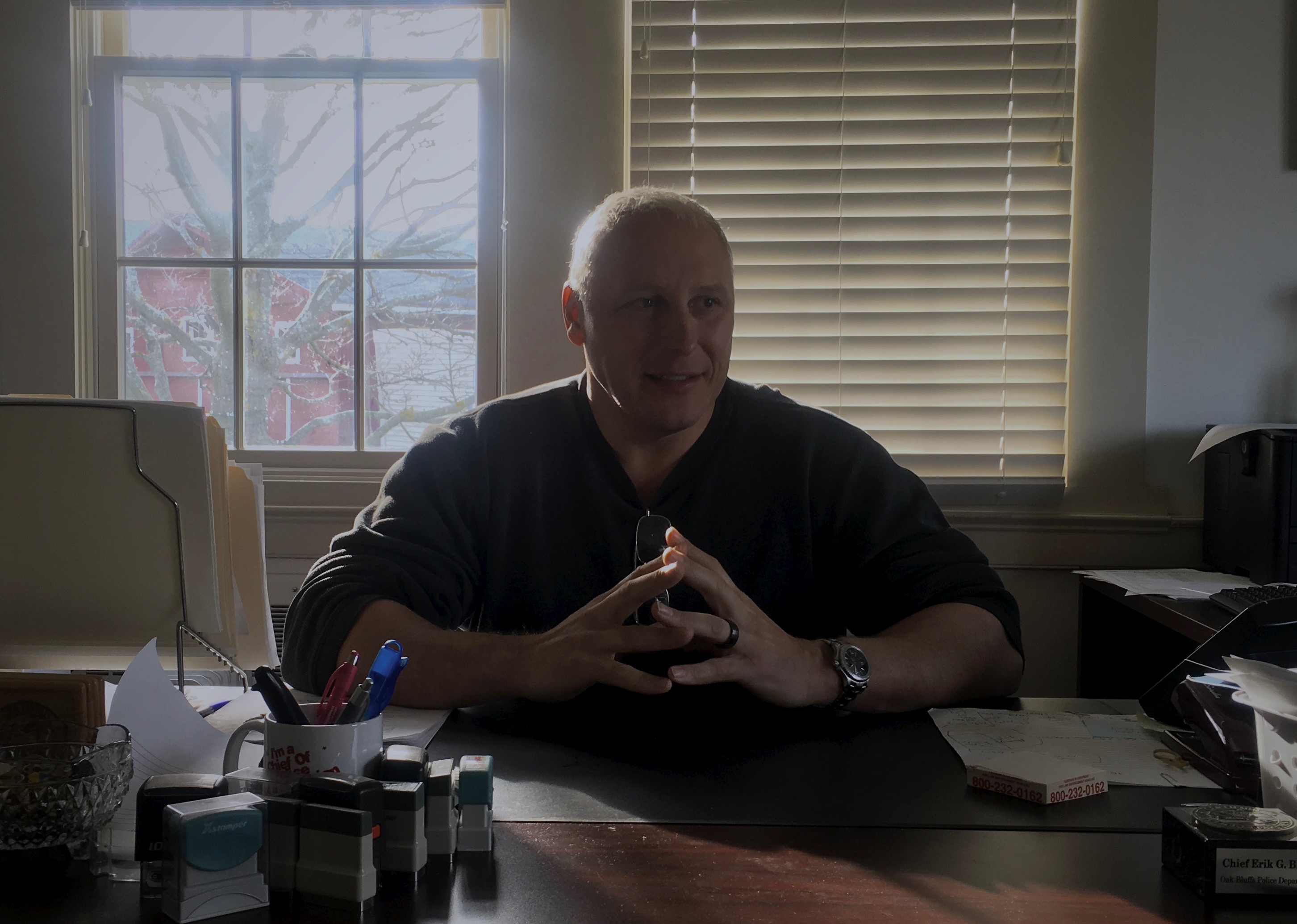 Oak Bluffs Police Chief Erik Blake sits at his desk. November 2018. Oak Bluffs, MA. Photo by James Albert Sneed