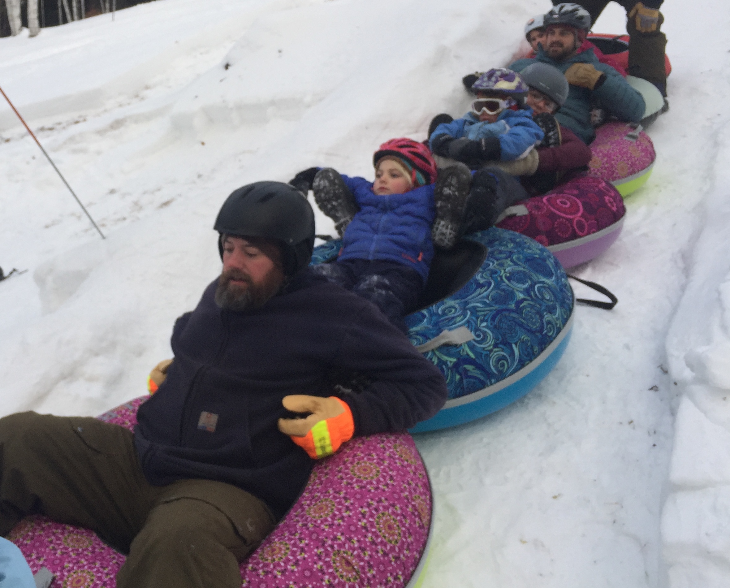 A train of tubes go down the giant luge in Thorton, New Hampshire. Photo by Bus Huxley