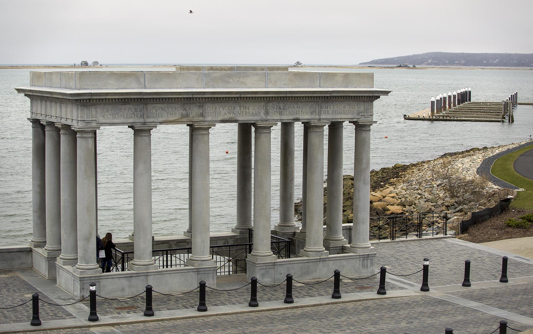 The Plymouth Rock portico looks out across the Plymouth Bay to Rocky Point, the location of Pilgrim Nuclear Power Station. Photo by Robin Lubbock for WBUR