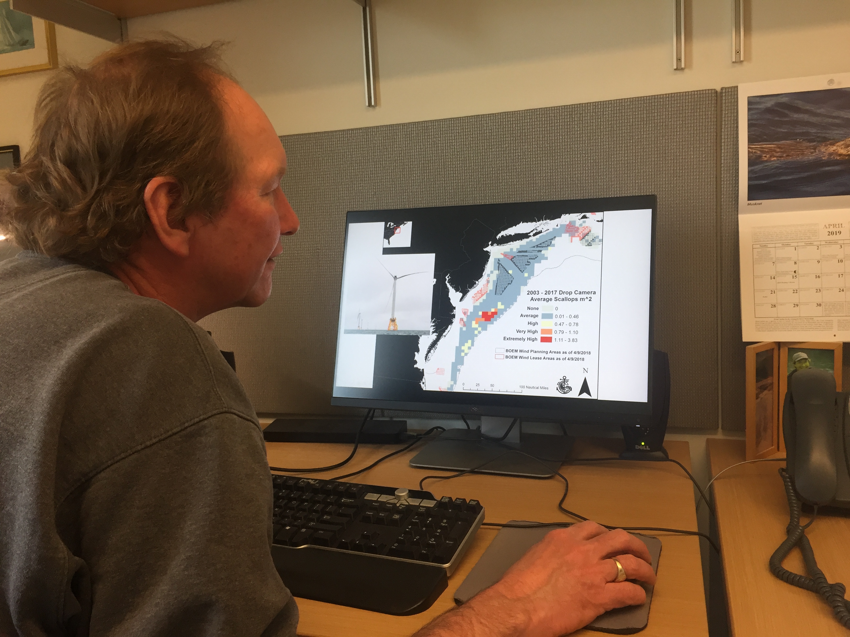 Dr. Kevin Stokesbury shows a map of scallop surveys and proposed offshore wind farms in the Mid-Atlantic. Photo by Nadine Sebai for The Public's Radio