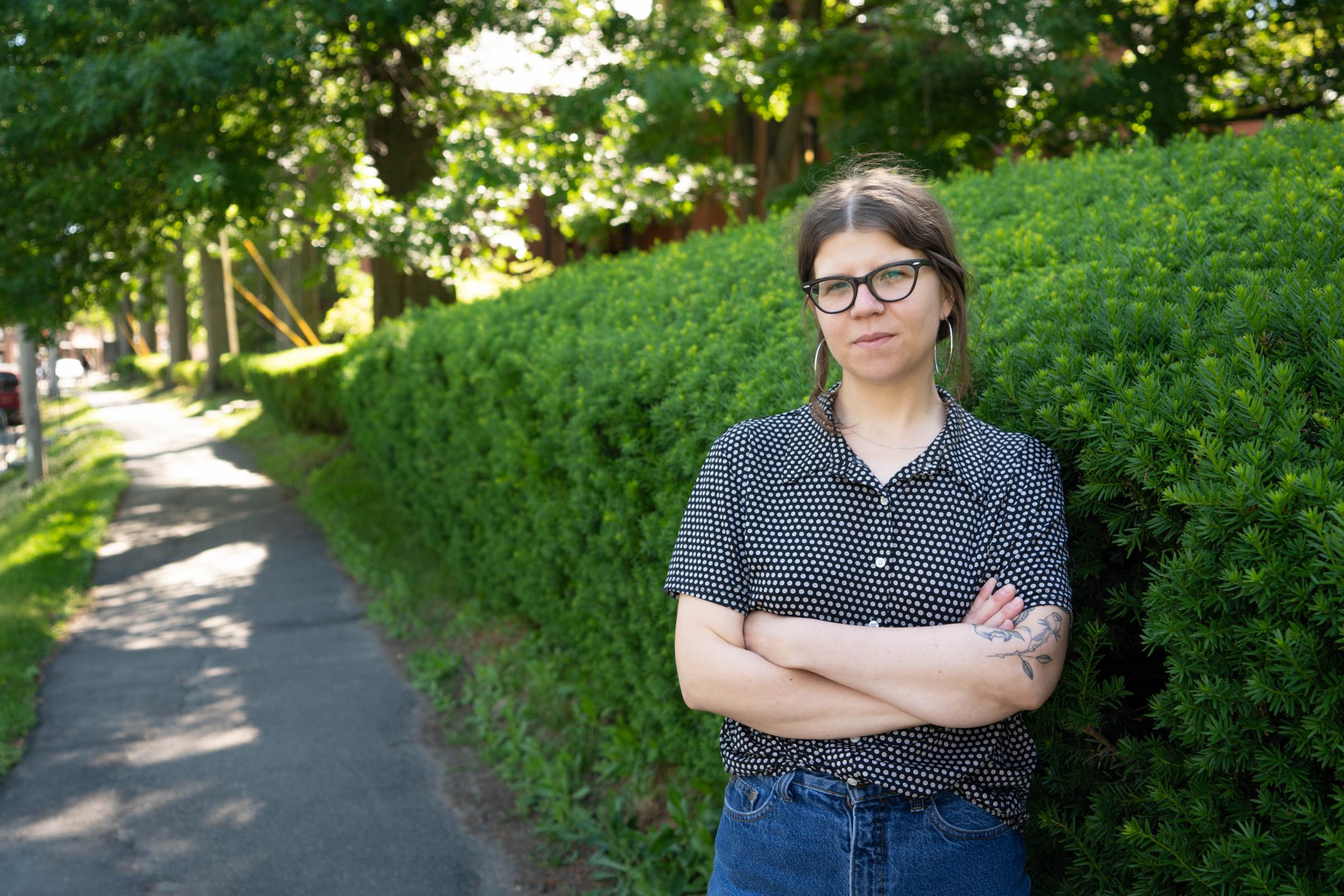 Lindsey Musielak, a former employee at the Iron Horse Entertainment Group box office, stands in front of her alma mater, Smith College, in Northampton, Massachusetts. Photo by Ellery Berenger for NEPR