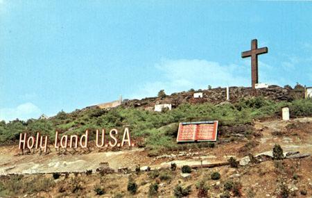 A postcard featuring the sign and cross at Holy Land, USA. Courtesy of Davis Dunavin