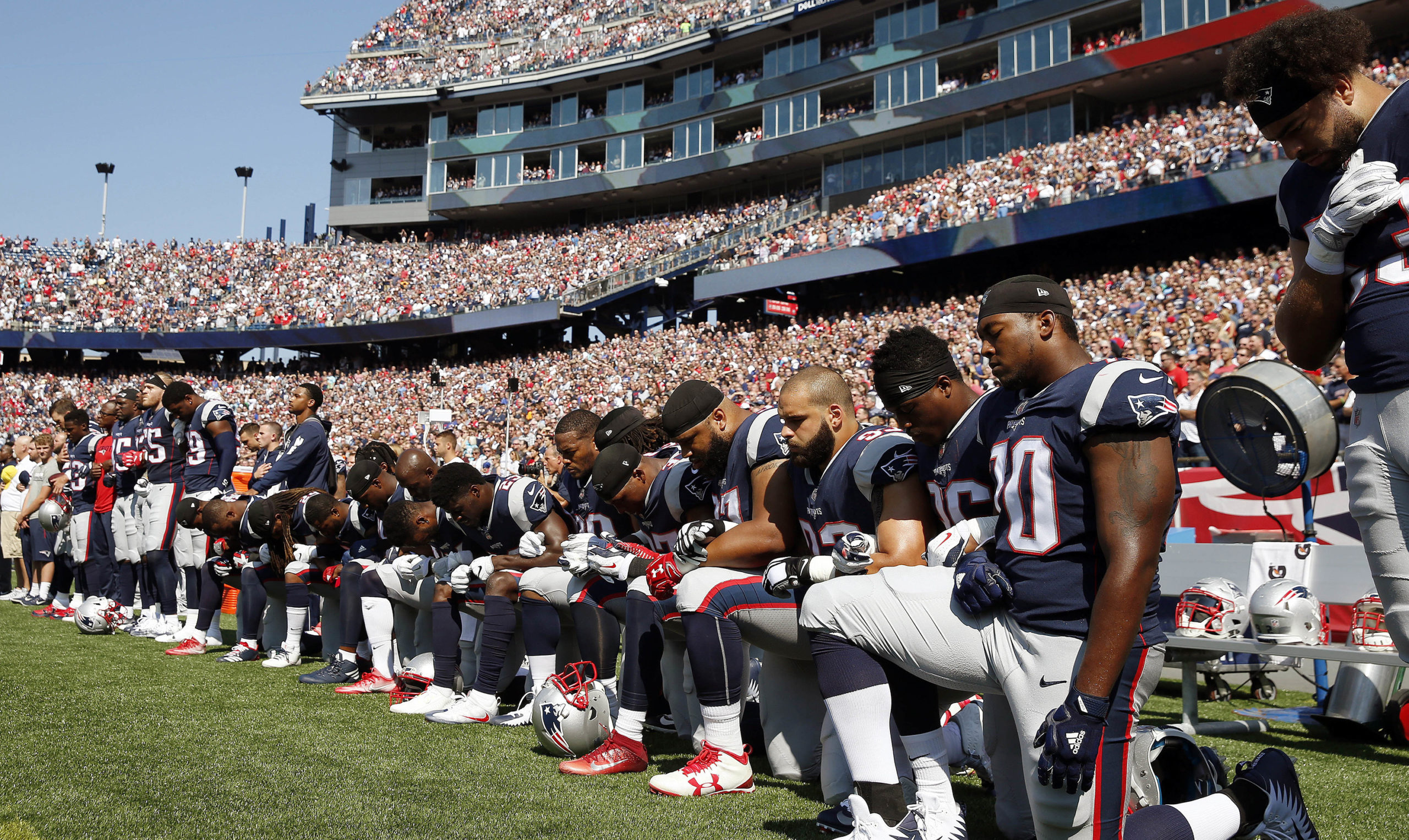 football players new england patriots take a knee national anthem