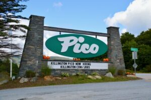 Photo of entrance to Pico Ski Resorts in Vermont with a sign that says the resort is hiring.