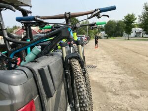 Two mountain bikes sit in a truck bed