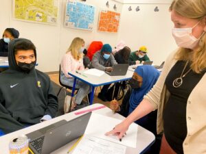 Teacher Susan Blethen supports students Kingston Kirkland and Isra Aden in this classroom in Burlington, Vermont.