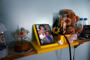 Glenda Cardenas’ daughter, Nathaly Torres, keeps a wedding photo of her mother and her late father, Miguel Torres, in her room.