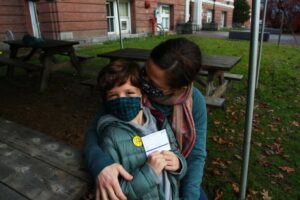 Owen and his mom Jessica sit for a portrait after Owen, who is 7, received his first COVID-19 vaccine on Wednesday, Nov. 10 at the Main Street Middle School in Montpelier