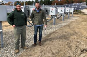 ReVision Energy’s Derek Turnbull, left, and Nick Sampson at a new “community solar” farm in Acton.