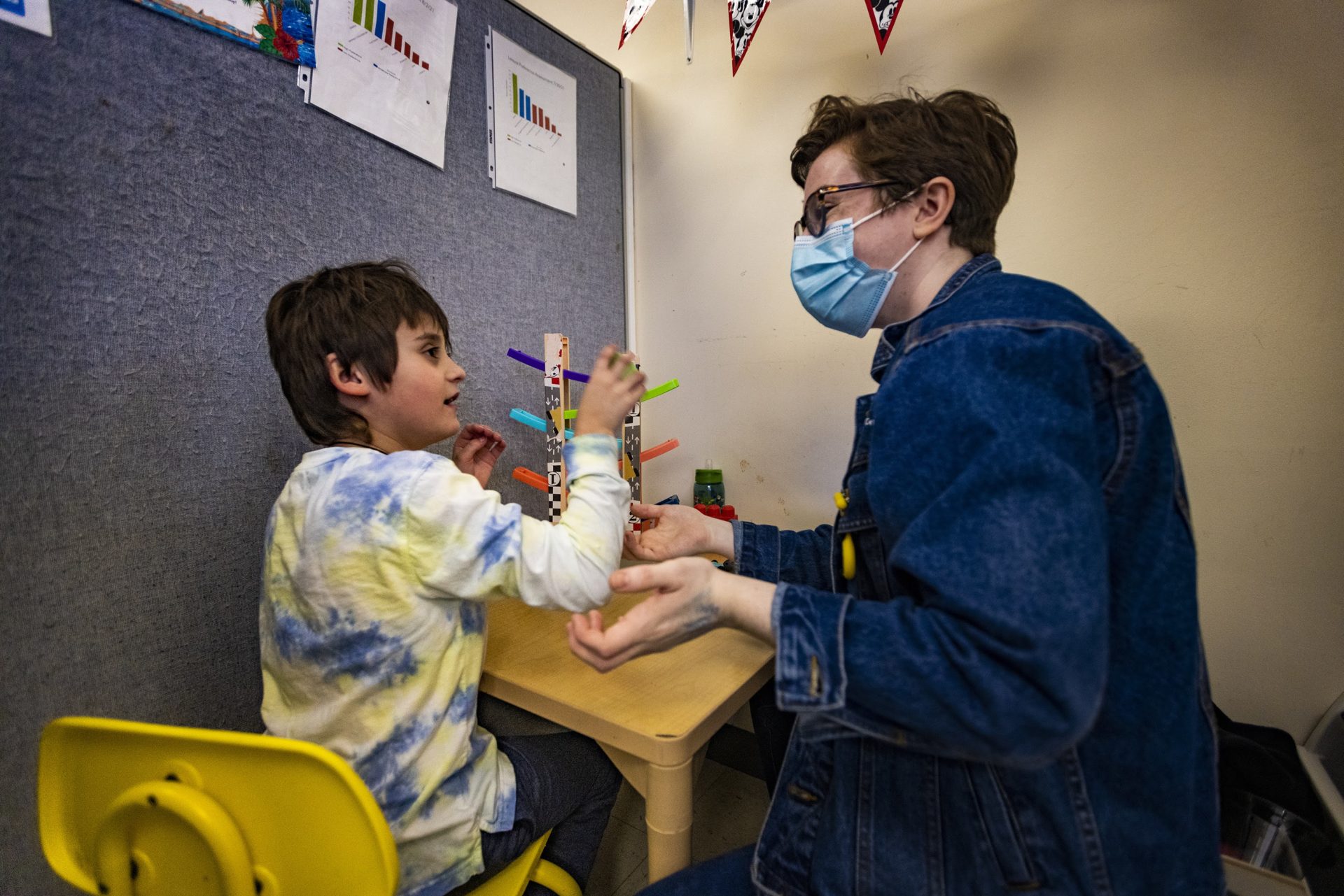 Teacher Kate McDermott plays an imitation game with a student at the New England Center for Children in Southborough, Mass.