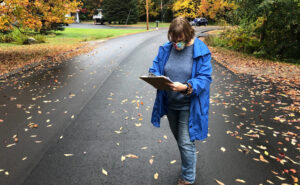 Planned Parenthood volunteer Sarah Mahoney checks a list of addresses in Windham, Maine to see which door to knock on next.